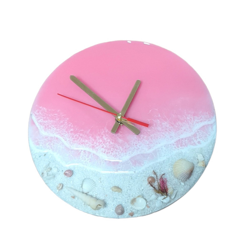 ساعت دیواری رزینی طرح دریای صورتی و ساحل سفید