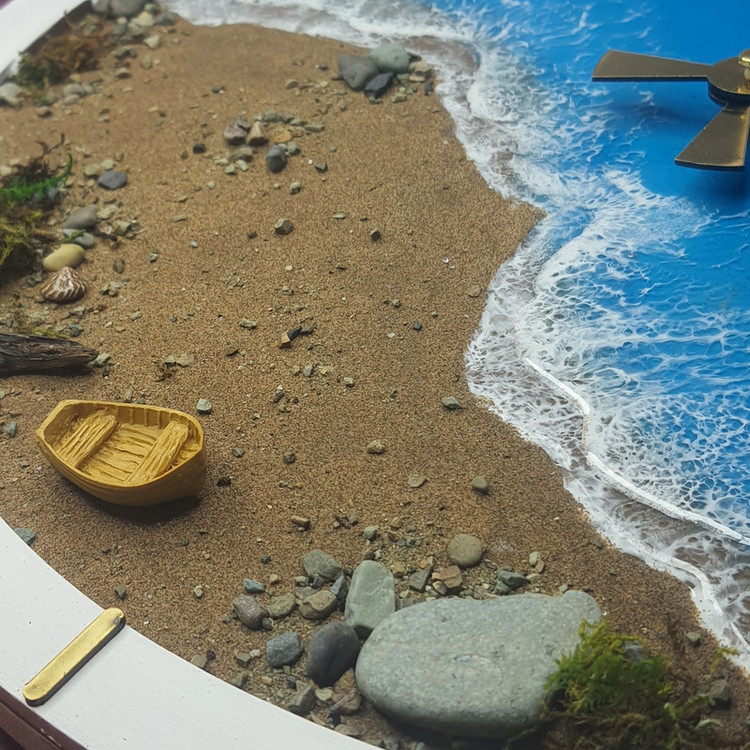 ساعت دیواری طرح ساحل و سنگ