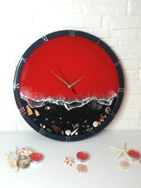 خرید ساعت دیواری رزینی طرح دریای قرمز و ساحل مشکی