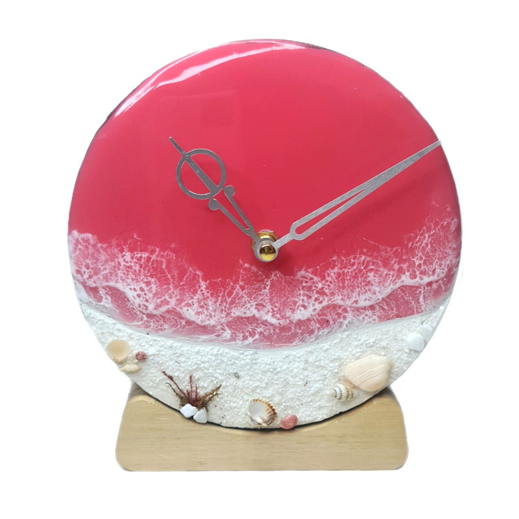 ساعت رومیزی صورتی رزینی طرح دریای صورتی و ساحل سفید